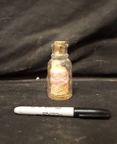 Glass jar with dried out dough inside
