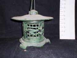 Green cast iron garden lantern
