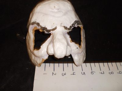 White mask with dark eyebrows and bulbous nose