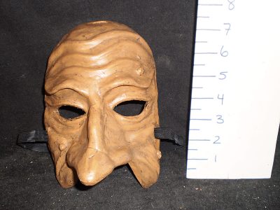 Brown mask with three moles