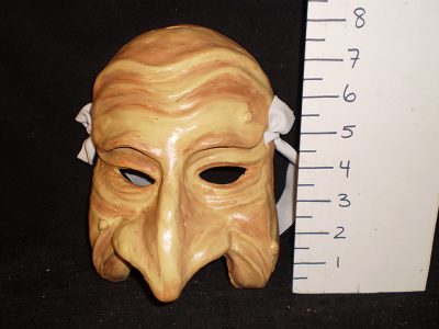 Light / flesh colored mask with curved nose