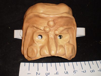 Warty mask with large brow ridges