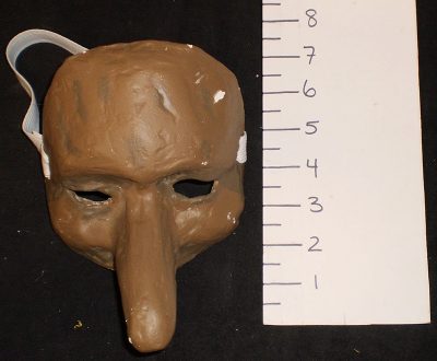 Sad brown half-mask, long nose