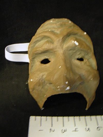 ¾ sad old face mask, wrinkled brow, brown