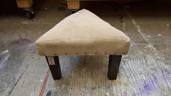 Small triangular foot stool