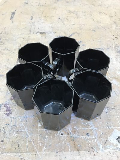 Octagonal black teacups