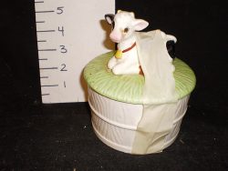 White porcelain container with cow on the lid