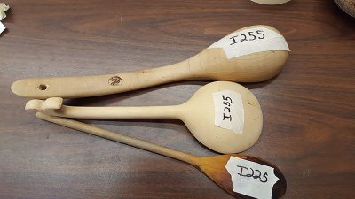 Black plastic ladle and Wooden Serving Spoons