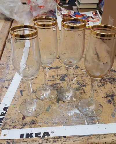 Set of gold rimmed Champagne flutes