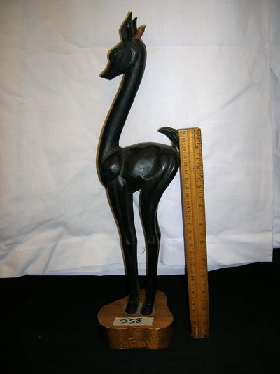 Black wooden deer with brown