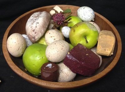 Bowl of mixed fruit, cheese, and eggs