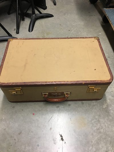 Beige with redish brown trim suitcase