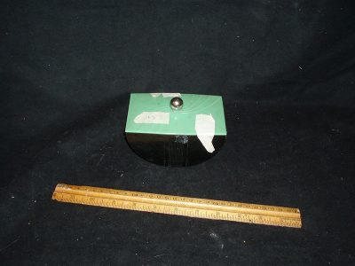 Plastic container with green lid