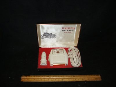 White electric razor in black case
