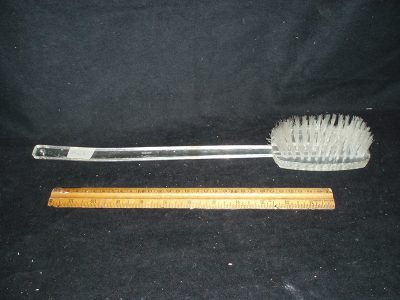 Clear plastic bath brush