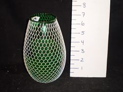 Green glass with white net candle