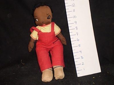 Brown stuffed doll (red overalls, yellow top)