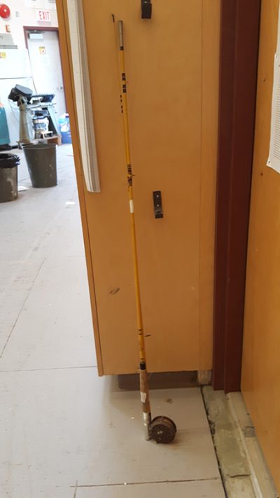 Old yellow fishing rod