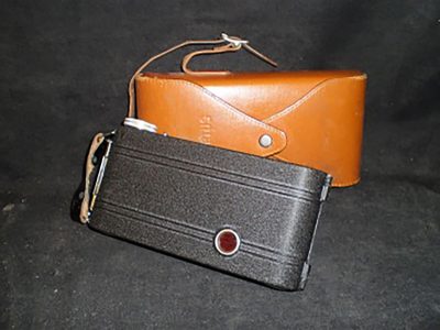 Black film camera (with a brown leather case)
