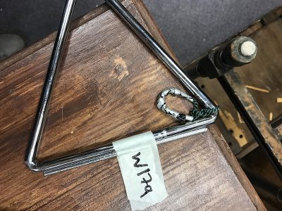 Steel Triangle and striker