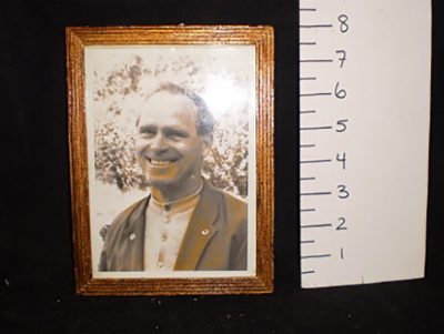 Picture of reverend father Leon with obituary