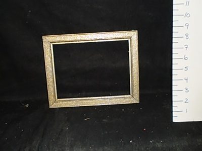 Gold-colored wooden frame with swirl pattern