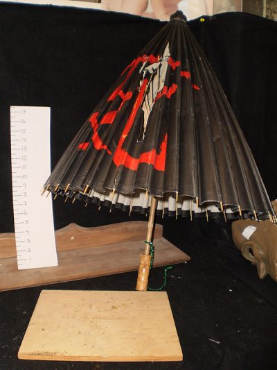 Black paper parasol with red design